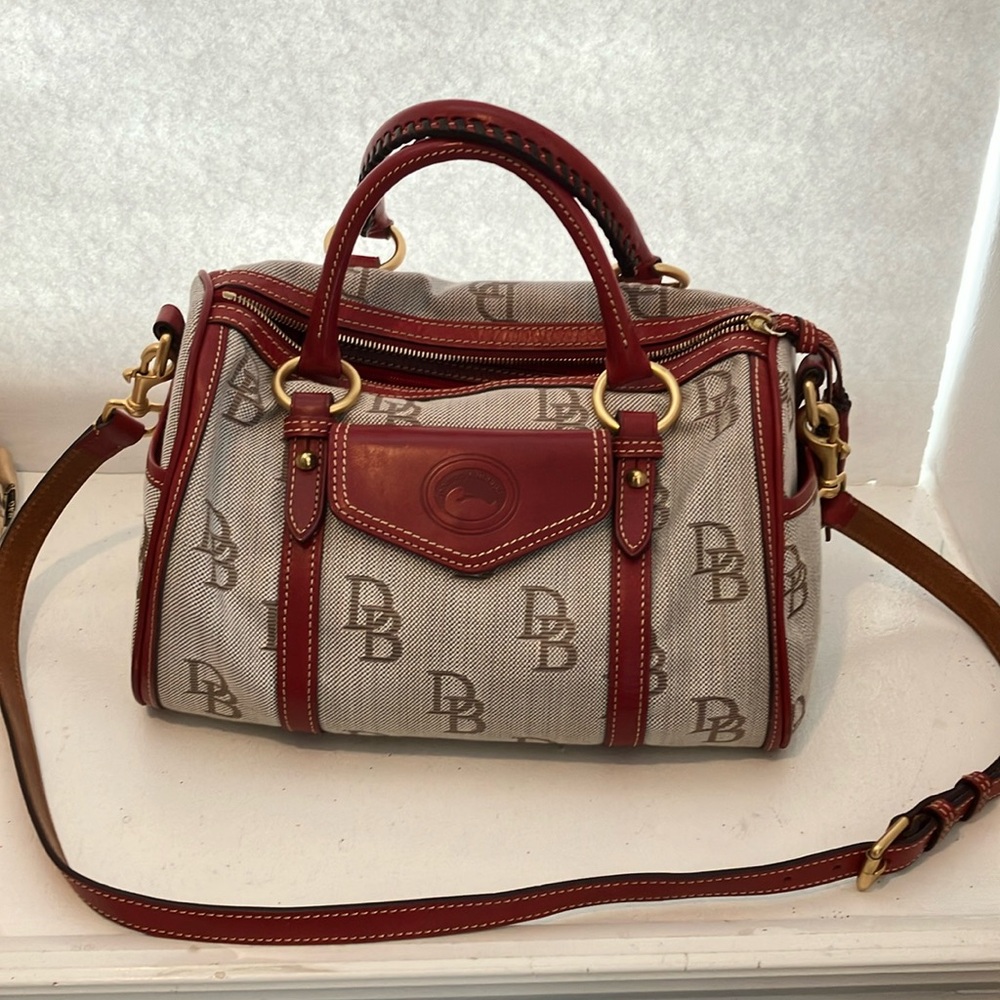 Dooney and Bourke barrel pocket satchel handbag. Red and brown. Preowned
